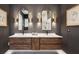Modern bath features a double vanity, elegant mirrors, stylish sconces, and luxurious countertop at 2166 Welch Ave, Charleston, SC 29412
