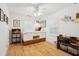 Bright bedroom featuring a bed with built-in storage, hardwood floors, and a ceiling fan at 2166 Welch Ave, Charleston, SC 29412