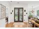 Welcoming entryway with hardwood floors, leading to the living and dining areas at 2166 Welch Ave, Charleston, SC 29412