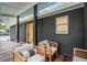 Charming front porch with chairs, a wood deck, and a view of the yard at 2166 Welch Ave, Charleston, SC 29412