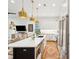 Open kitchen featuring a large island, stainless steel appliances, and an adjacent living area at 2166 Welch Ave, Charleston, SC 29412