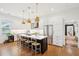 Bright, spacious kitchen with white cabinets, stainless steel appliances, and island seating at 2166 Welch Ave, Charleston, SC 29412