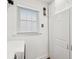 Bright laundry room with white cabinets, modern appliances, and a convenient folding rack at 2166 Welch Ave, Charleston, SC 29412