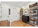 Bright office with wood floors, built-in shelves, and a dark cabinet for extra storage at 2166 Welch Ave, Charleston, SC 29412