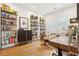 Office space with hardwood floors, built-in shelving, and a large desk with natural light at 2166 Welch Ave, Charleston, SC 29412