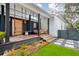 Charming porch features a swing, comfortable seating, and stylish design, perfect for relaxing and enjoying the outdoors at 2166 Welch Ave, Charleston, SC 29412