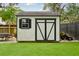 View of backyard shed, including yard and a dining area at 2166 Welch Ave, Charleston, SC 29412