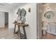 Stylish entryway featuring modern art and leads into a bathroom showcasing unique sink and fixtures, adding an artistic touch at 2276 Seascape Ct, Seabrook Island, SC 29455