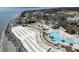 Stunning beach resort aerial view with pools, ocean access, and many lounge chairs at 2276 Seascape Ct, Seabrook Island, SC 29455