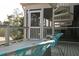 Outdoor deck featuring a white spiral staircase and an outdoor seating area at 2276 Seascape Ct, Seabrook Island, SC 29455