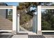 Deck showing wood floor, view of a house, and a pathway to the back at 2276 Seascape Ct, Seabrook Island, SC 29455