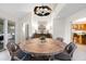 Stylish dining space showcasing a round wooden table, woven chairs, and modern decor for delightful gatherings at 2276 Seascape Ct, Seabrook Island, SC 29455