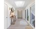 Bright entryway featuring modern art and glass doors with view of lush greenery, combining style and natural light at 2276 Seascape Ct, Seabrook Island, SC 29455