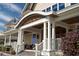 Elegant front porch with decorative columns and comfortable seating, enhancing curb appeal at 2276 Seascape Ct, Seabrook Island, SC 29455