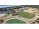 Expansive aerial view of a golf course and surrounding residences near the ocean at 2276 Seascape Ct, Seabrook Island, SC 29455