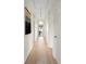 Bright hallway with neutral paint, light wood floors and stylish decorations at 2276 Seascape Ct, Seabrook Island, SC 29455