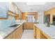 Spacious kitchen with stainless steel appliances, light wood cabinets, and ample counter space at 2276 Seascape Ct, Seabrook Island, SC 29455