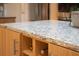 Close-up shot of kitchen island with unique countertop design and built-in wine storage at 2276 Seascape Ct, Seabrook Island, SC 29455