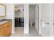 Bathroom features a vanity and a separate laundry room with washer, dryer, and built-in shelves at 2276 Seascape Ct, Seabrook Island, SC 29455