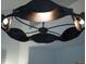 Modern lighting fixture with hammered metal, curved accents, and multiple visible bulbs at 2276 Seascape Ct, Seabrook Island, SC 29455
