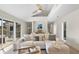 Comfortable living area featuring a large sectional sofa, stylish pillows, and sliding doors to the outdoor deck at 2276 Seascape Ct, Seabrook Island, SC 29455