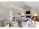 Inviting living room boasts natural light, stylish furnishings, and a cozy fireplace for comfortable living at 2276 Seascape Ct, Seabrook Island, SC 29455