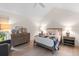 Bright bedroom featuring a vaulted ceiling, light wood floors, and a serene color palette at 2276 Seascape Ct, Seabrook Island, SC 29455