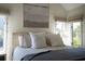Bright main bedroom with neutral decor, an art piece above the bed, and natural light at 2276 Seascape Ct, Seabrook Island, SC 29455