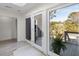 Bright room with glass doors leading to a patio with view of lush greenery, bringing the outdoors inside at 2276 Seascape Ct, Seabrook Island, SC 29455