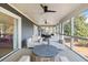 Comfortable screened in patio with ceiling fans and outdoor seating area at 2276 Seascape Ct, Seabrook Island, SC 29455