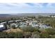Aerial view of multiple tennis courts surrounded by lush greenery and waterfront scenery at 2276 Seascape Ct, Seabrook Island, SC 29455