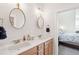 Dual sink bathroom featuring dual mirrors, white countertop, and wood vanity at 2514 Bullock Guard Dr, Johns Island, SC 29455