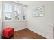 Bright room with wood floors, three windows, and a painting at 2514 Bullock Guard Dr, Johns Island, SC 29455