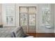 Bedroom details showcase a hanging chair, plantation shutters, and stylish lighting at 2514 Bullock Guard Dr, Johns Island, SC 29455