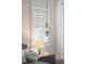 Bedroom details showcase a decorative lamp, plantation shutters, and tasteful accents at 2514 Bullock Guard Dr, Johns Island, SC 29455