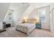 Bright bedroom with pitched ceilings, a ceiling fan, and two bedside tables at 2514 Bullock Guard Dr, Johns Island, SC 29455
