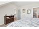 Bright bedroom with a dresser, two pieces of wall art and a view into the hall at 2514 Bullock Guard Dr, Johns Island, SC 29455