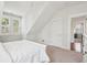 Bright bedroom with pitched ceilings, windows, and white furniture at 2514 Bullock Guard Dr, Johns Island, SC 29455