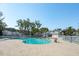 Large community pool surrounded by palm trees and a charming clubhouse, perfect for summer fun at 2514 Bullock Guard Dr, Johns Island, SC 29455
