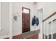 Inviting foyer with hardwood floors, a wooden door with glass, and a coat rack for convenience at 2514 Bullock Guard Dr, Johns Island, SC 29455
