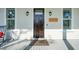 Elegant front door with sidelights, exterior lighting, and a welcoming sign at 2514 Bullock Guard Dr, Johns Island, SC 29455