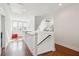 Bright hallway with hardwood floors and staircase at 2514 Bullock Guard Dr, Johns Island, SC 29455