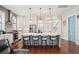 Bright kitchen with a center island with seating, stainless steel appliances, and sleek white cabinets at 2514 Bullock Guard Dr, Johns Island, SC 29455