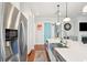 Kitchen island with sink and stainless steel appliances, and a turquoise door at 2514 Bullock Guard Dr, Johns Island, SC 29455