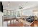 Open living room featuring recessed lights, a ceiling fan, fireplace and floor to ceiling doors to the outside at 2514 Bullock Guard Dr, Johns Island, SC 29455