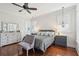 The main bedroom showcases hardwood floors, plantation shutters, and a ceiling fan at 2514 Bullock Guard Dr, Johns Island, SC 29455