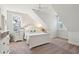 Bright main bedroom with pitched ceilings, windows, and white furniture at 2514 Bullock Guard Dr, Johns Island, SC 29455