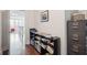 Hallway and office area featuring dark shelving unit, filing cabinet, and a scenic picture at 2514 Bullock Guard Dr, Johns Island, SC 29455