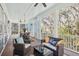 Spacious screened-in porch with wicker furniture, a ceiling fan, and an inviting atmosphere at 2514 Bullock Guard Dr, Johns Island, SC 29455