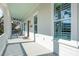 Expansive front porch features a blue ceiling, rocking chairs, and a view of the neighborhood at 2514 Bullock Guard Dr, Johns Island, SC 29455